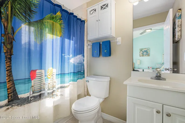 a bedroom with a bed and large window