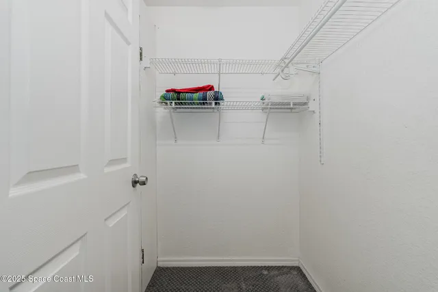a bathroom with a sink a toilet and shower curtain