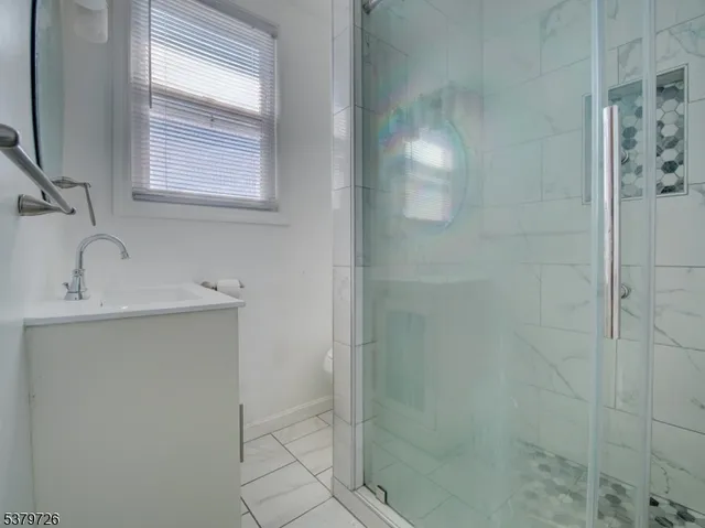 a bathroom with a sink and shower