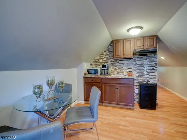 a kitchen with stainless steel appliances granite countertop a stove a sink dishwasher and a microwave