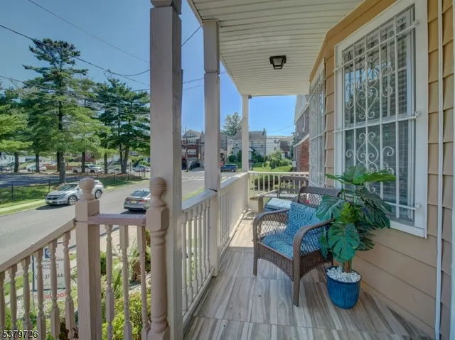 a view of a balcony with chairs