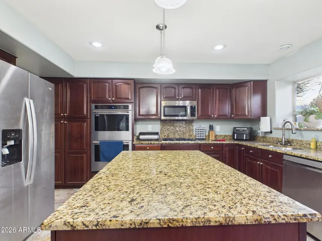 a view of a backyard with a patio