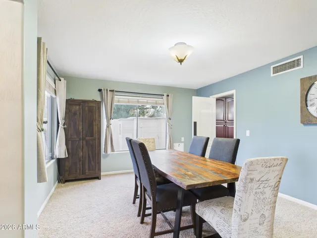 a view of a backyard with a patio and a garden