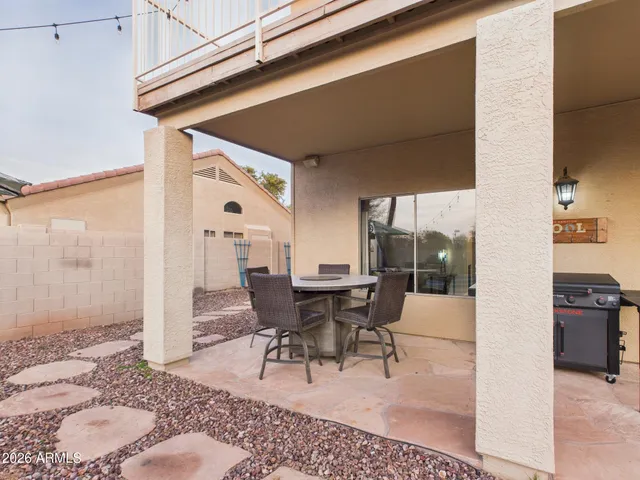 a bathroom with a toilet a sink a mirror and vanity