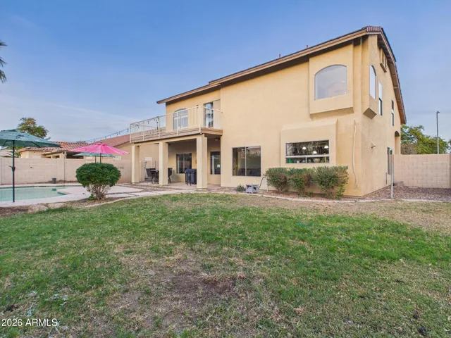 a view of a chair and table in the garden