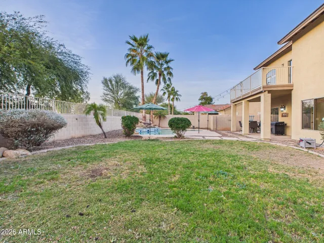 a bathroom with a toilet a sink a mirror and a shower