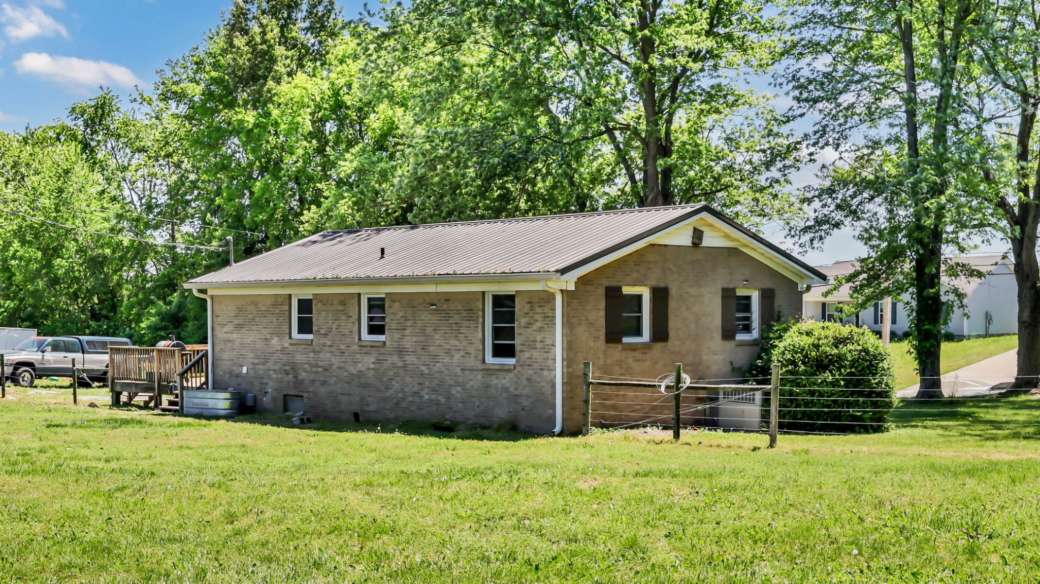 1068 Hugh Hunter Road Oak Grove, KY 42262 - Photo 25 of 30 a front view of house with yard and trees in the background