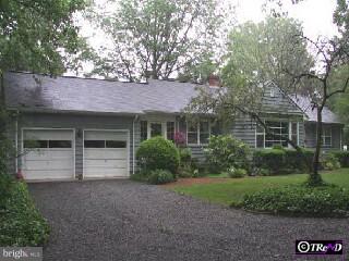 1317 Neck Road Burlington, NJ 08016 - Photo 1 of 1 a front view of a house with a garden and yard