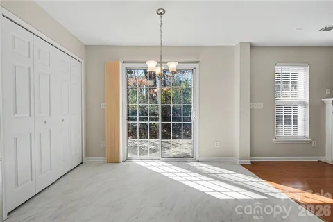 a view of a room with large windows