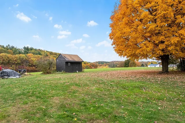 a fire hydrant in the middle of a field