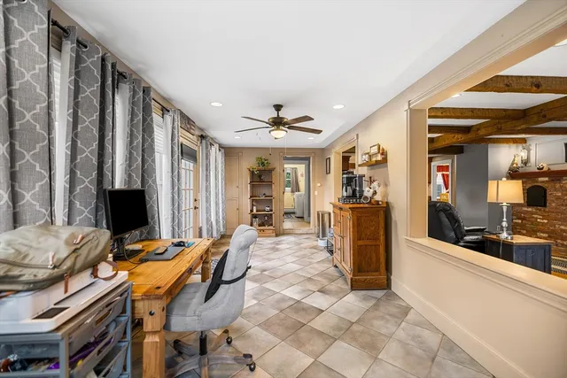 a view of a dining room with furniture and a kitchen