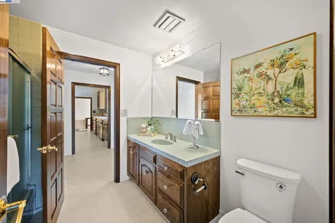 a bathroom with a sink a vanity and a mirror