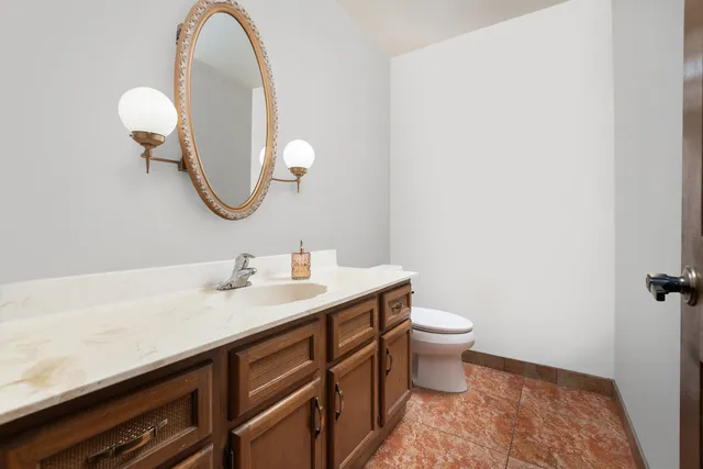 a view of workspace with a window beside a bedroom