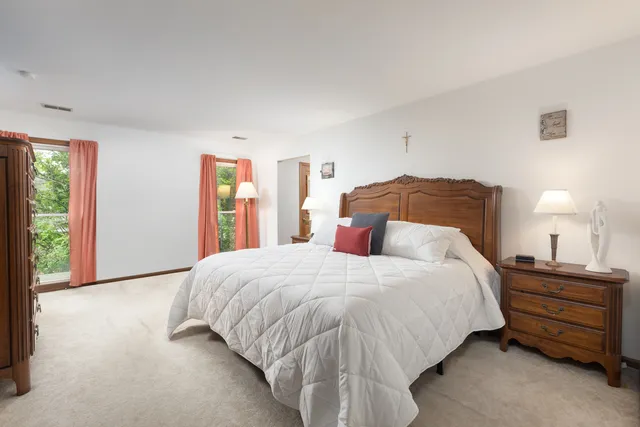 a bedroom with a bed and a closet