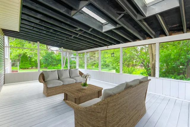 a front view of a house with a yard and green space