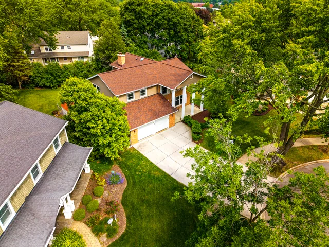 an aerial view of a house with a garden