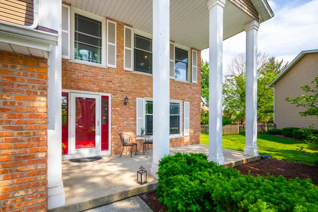 a view of a hallway with bathroom and a tub