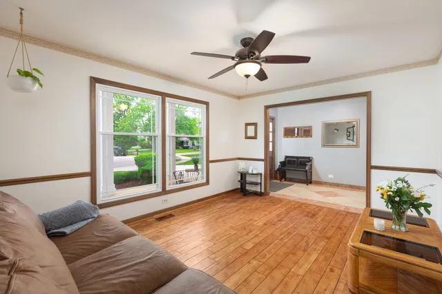 a view of a dining room with furniture and a chandelier