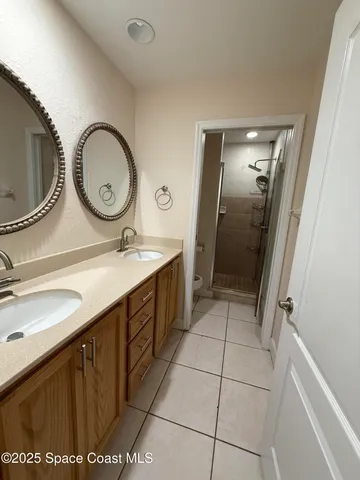 a bathroom with a sink vanity and a mirror