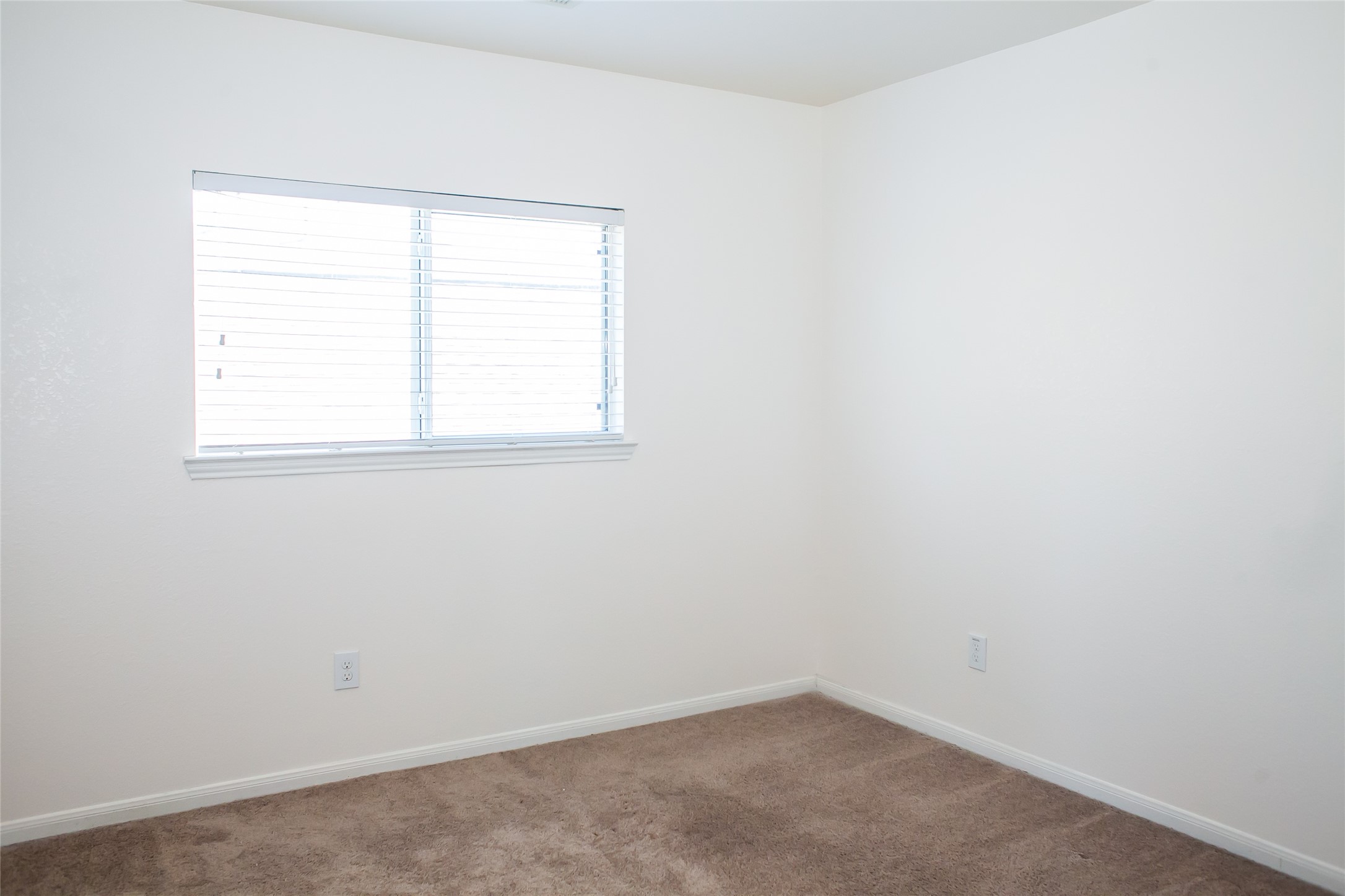 7015 Rancho Mission Drive Houston, TX 77083 - Photo 16 of 21 an empty room with a window
