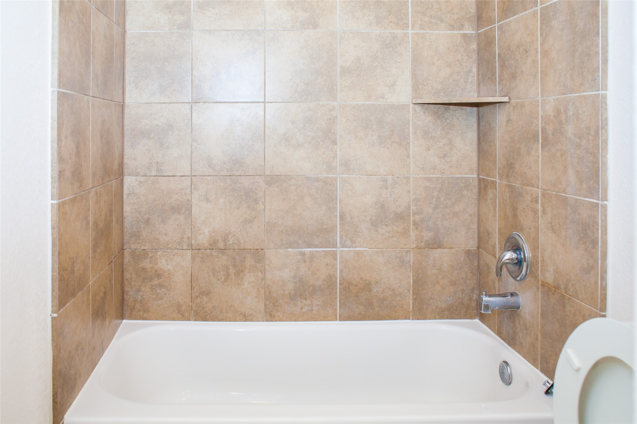 7015 Rancho Mission Drive Houston, TX 77083 - Photo 19 of 21 a bathroom with a bathtub