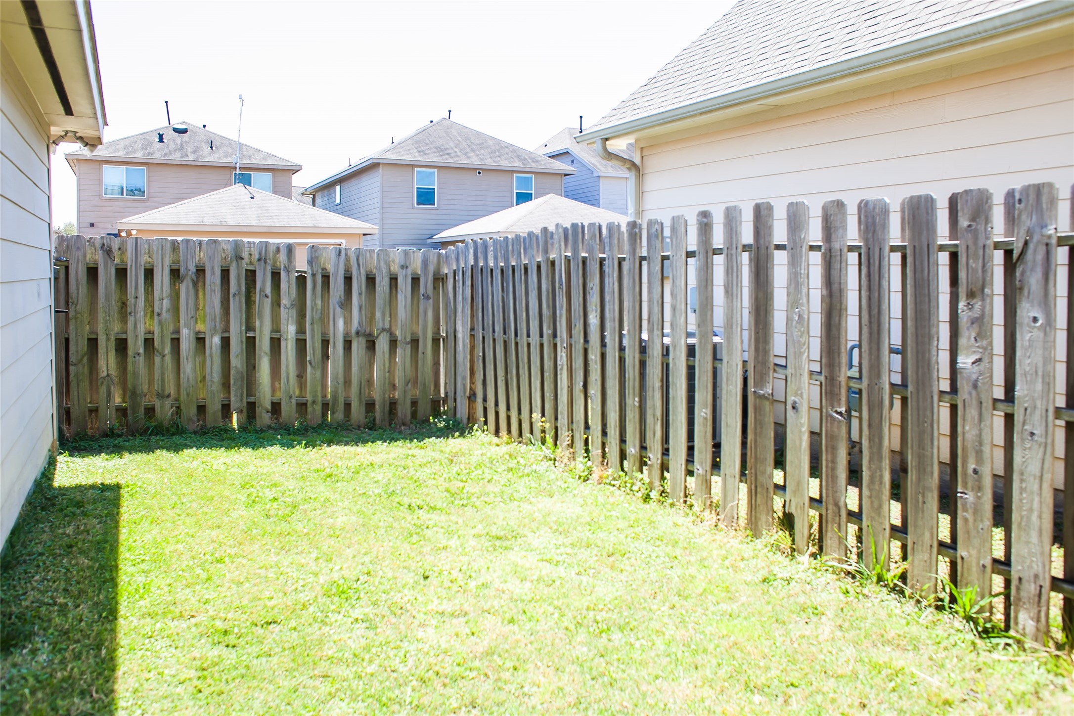 7015 Rancho Mission Drive Houston, TX 77083 - Photo 21 of 21 a front view of a house with a garden