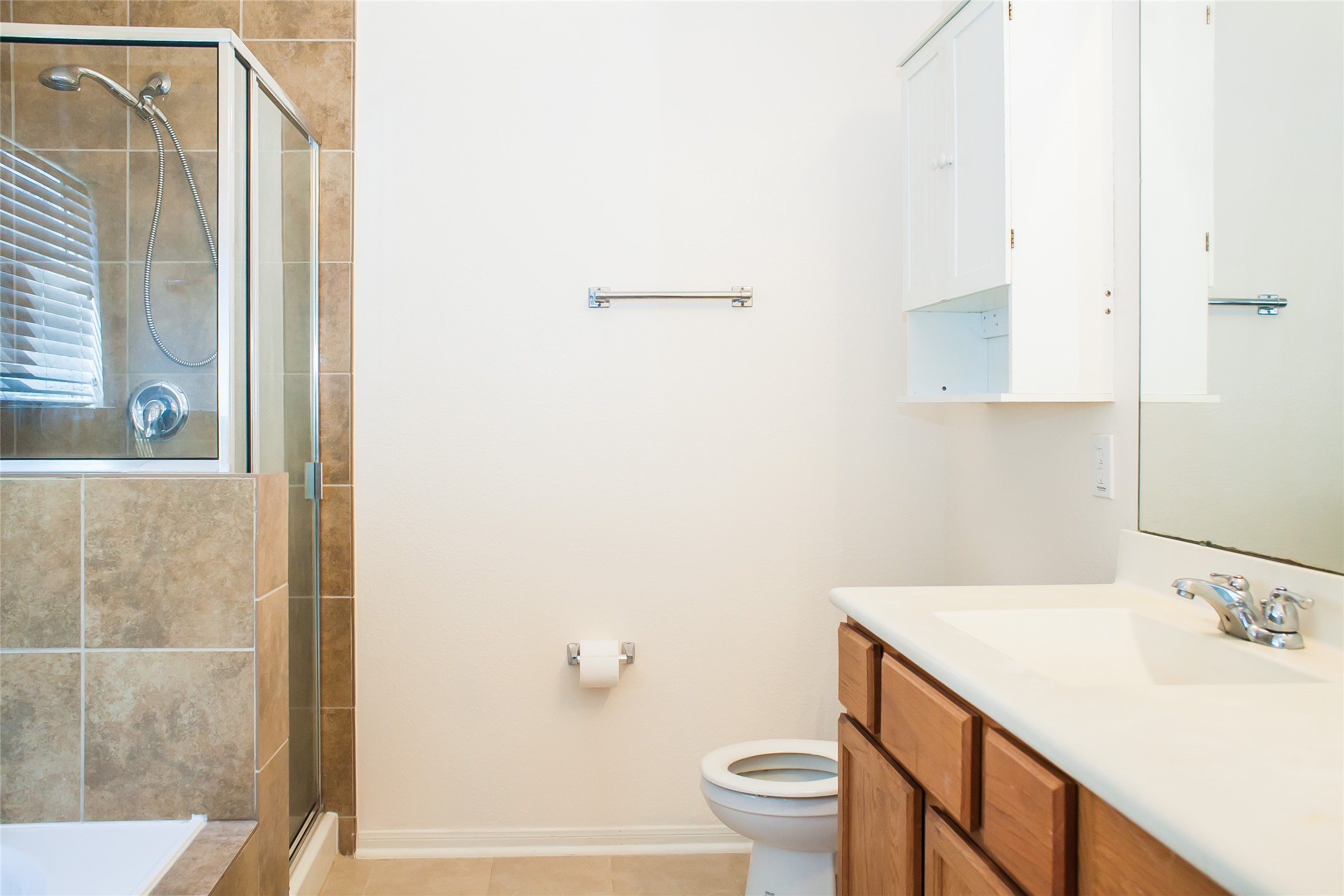 7015 Rancho Mission Drive Houston, TX 77083 - Photo 6 of 21 a bathroom with a sink toilet and shower