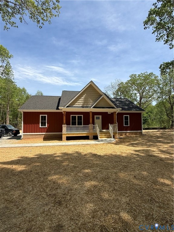 The property features a red facade, a front porch