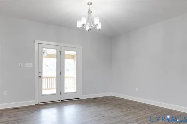 a view of kitchen with granite countertop cabinets and wooden floor