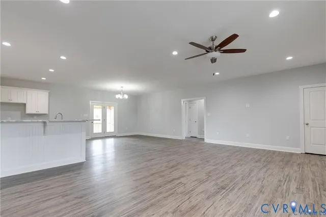 a view of kitchen with wooden floor and window