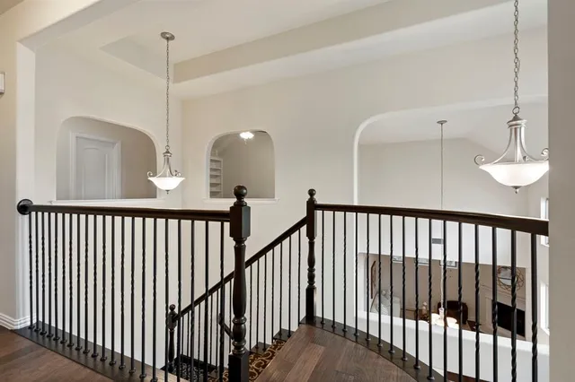 a view of a hallway with a chandelier