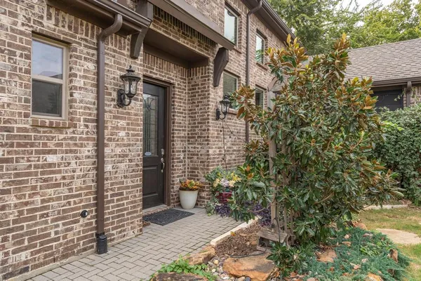 a view of a brick house with a door