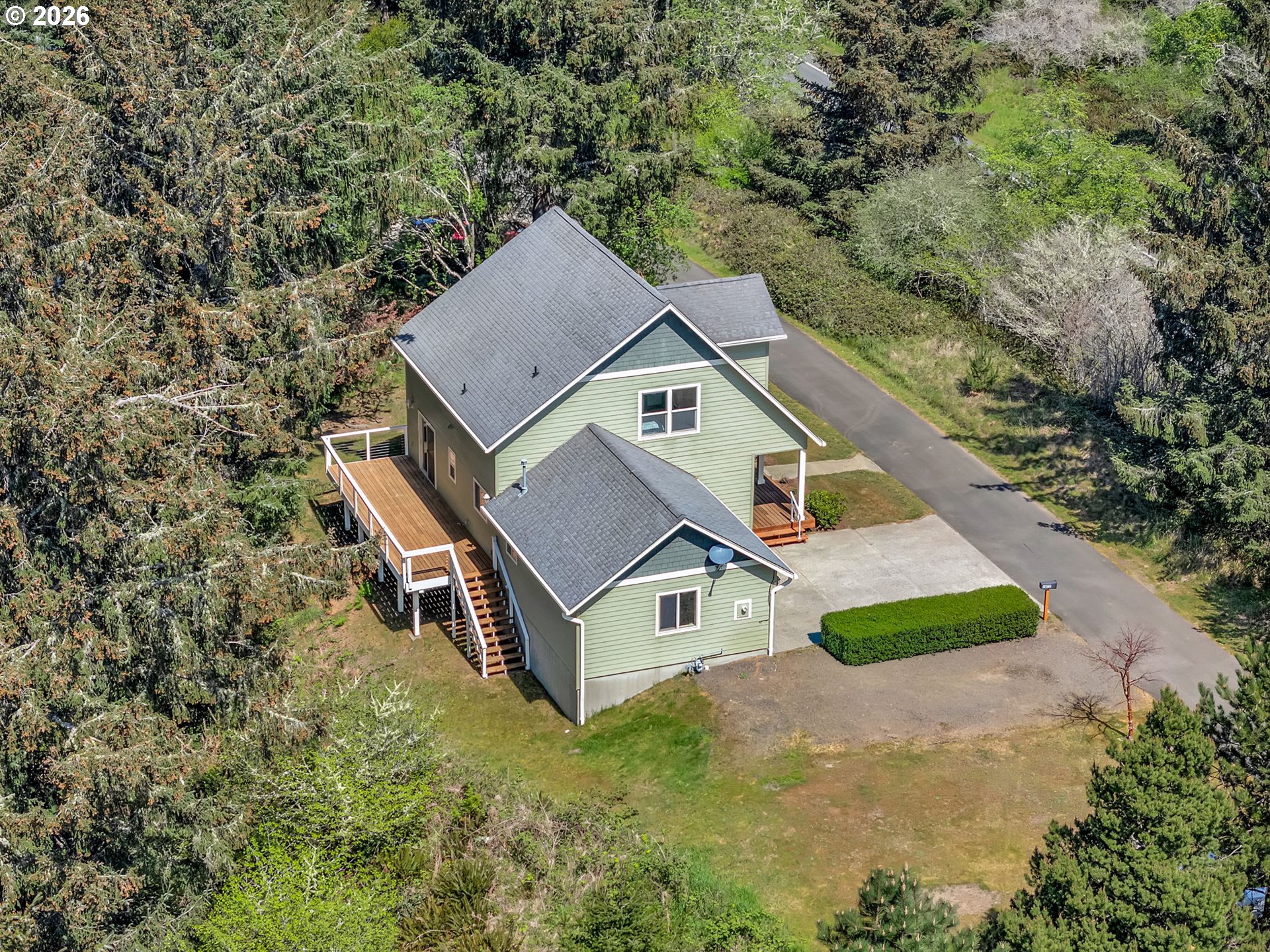 1077 Southwest Ridge Road Warrenton, OR 97146 - Photo 45 of 46 an aerial view of a house with a yard