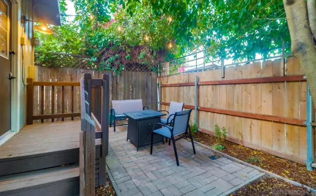 a view of a deck with table and chairs and wooden floor