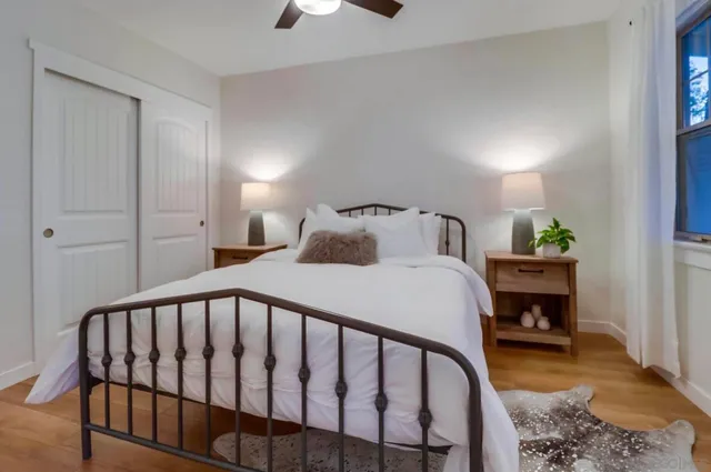 a bedroom with a bed and a table