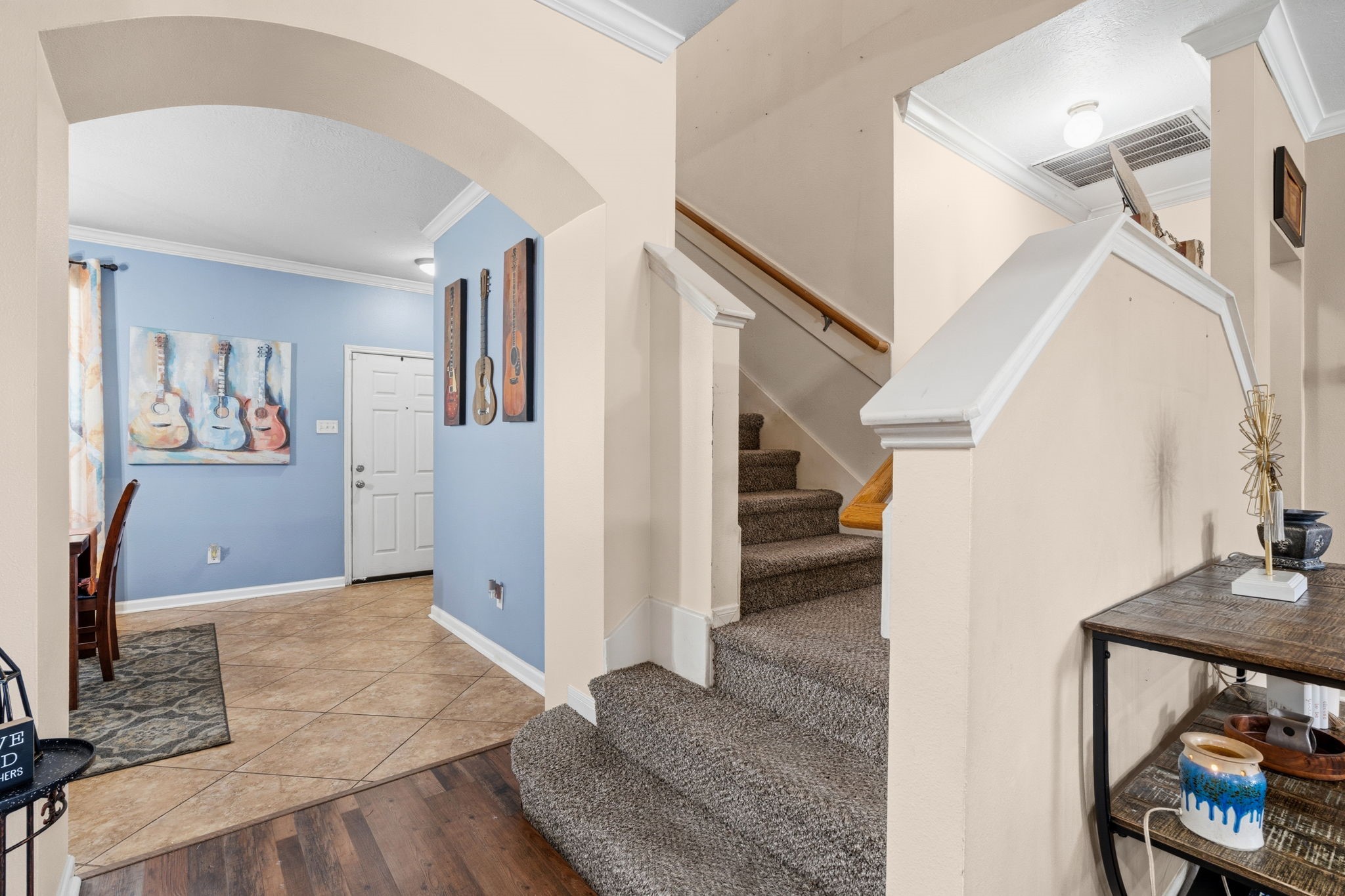1319 Collier Point Lane Fresno, TX 77545 - Photo 14 of 33 Architectural details, including graceful archways and a striking staircase, add character and charm to the main living areas.