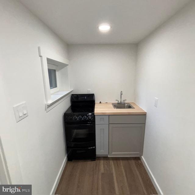 2317 Callow Avenue, Unit B Baltimore, MD 21217 - Photo 3 of 5 a room with a sink and a mirror