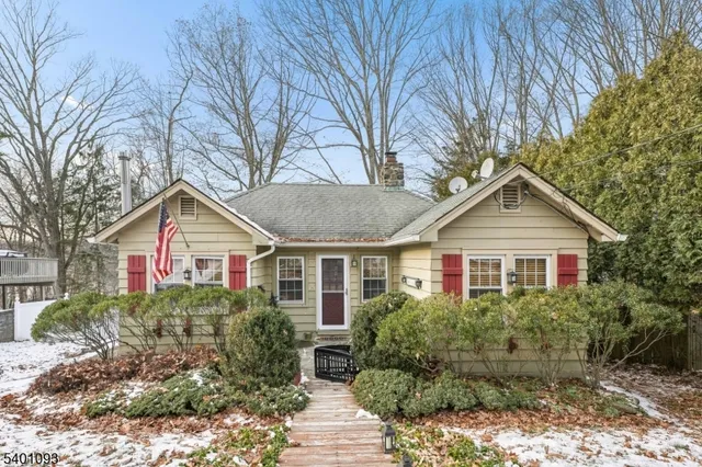 a house that has a tree in front of it