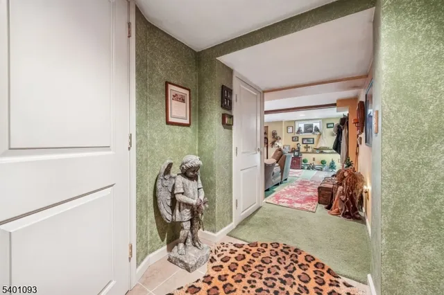 a bedroom with furniture and large windows