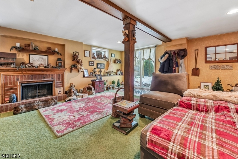 54 Hillside Road Sparta, NJ 07871 - Photo 23 of 45 a living room with furniture and a fireplace