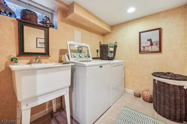 a view of a roof deck with table and chairs and wooden fence