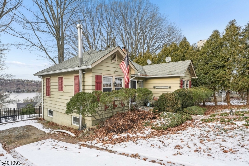 54 Hillside Road Sparta, NJ 07871 - Photo 33 of 45 a front view of a house with a yard and potted plants