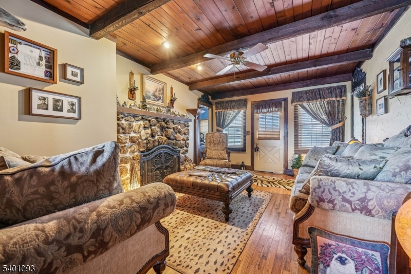 54 Hillside Road Sparta, NJ 07871 - Photo 5 of 45 a living room with furniture and a flat screen tv