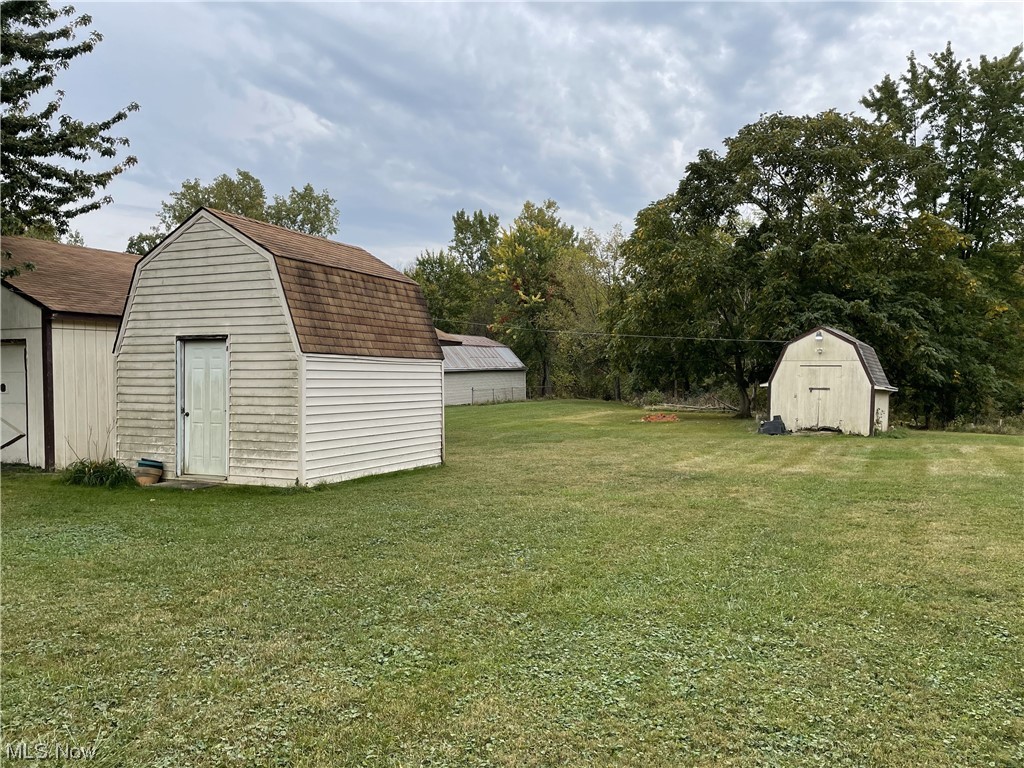 4107 Jaeger Road Lorain, OH 44053 - Photo 3 of 33 View of yard featuring a storage shed