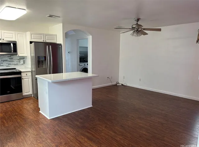 a view of kitchen with cabinets and stainless steel appliances