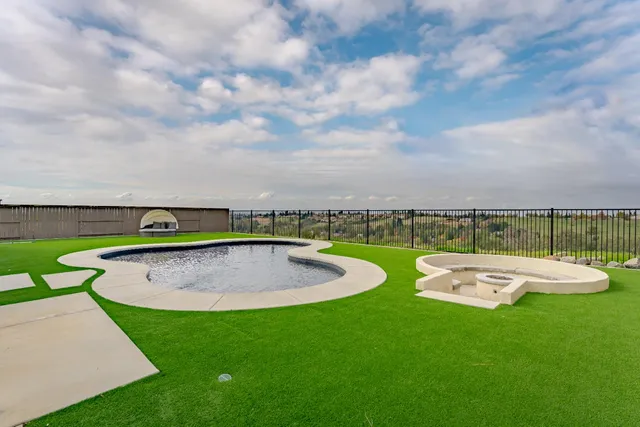 a view of a table and chairs in the park