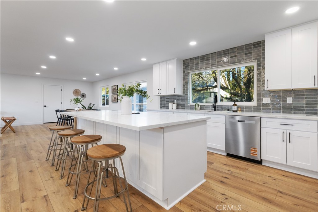 4150 Lobos Avenue Atascadero, CA 93422 - Photo 24 of 59 a kitchen with kitchen island a sink table and chairs