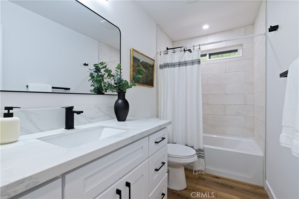 4150 Lobos Avenue Atascadero, CA 93422 - Photo 34 of 59 a bathroom with a sink a toilet and shower