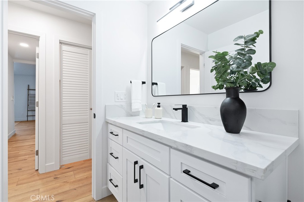 4150 Lobos Avenue Atascadero, CA 93422 - Photo 36 of 59 a bathroom with a sink a vanity and a mirror