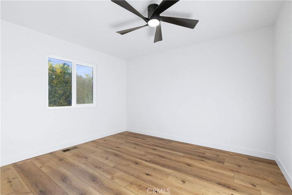 4150 Lobos Avenue Atascadero, CA 93422 - Photo 37 of 59 an empty room with a window and a ceiling fan